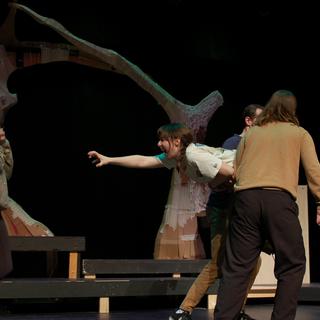 Hermia (Kaylin Zach) reaches her arms out to scratch Helena’s (Aimee Sweetapple) eyes out while being carried away by two other actors