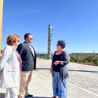 Sheila Malcolmson, MLA for Nanaimo, Richard Horbachewski and Lillian Morton tour the outside of Shq’apthut