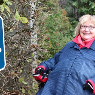 Dr. Linda Derksen with a ramp sign