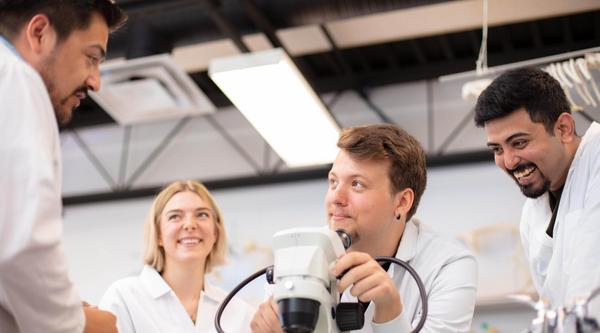 Four students in a biology lab