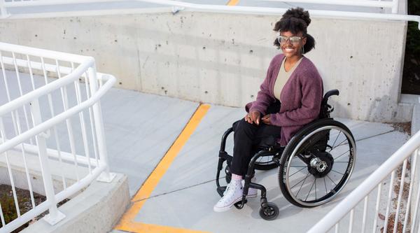 VIU student Agasha Mutesasira poses on one of the new accessibility ramps at VIUs Nanaimo campus