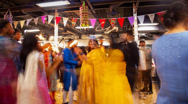 People dancing with sparklers