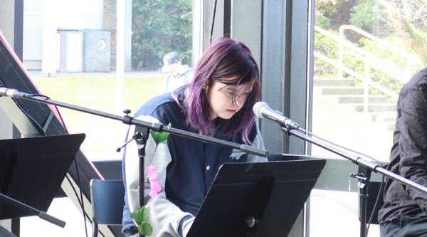 Ceridwen Nord does a dramatic reading during VIU's International Women's Day event.