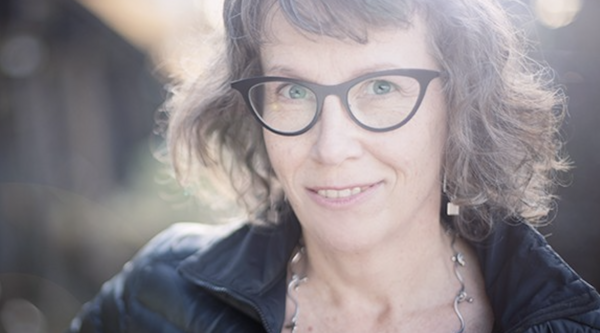 Hilary Peach smiling at the camera