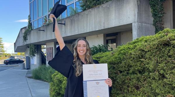 VIU graduate Robyn Doll smiling with diploma