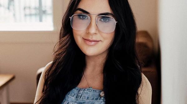 Samantha Beyond sitting and looking directly at camera