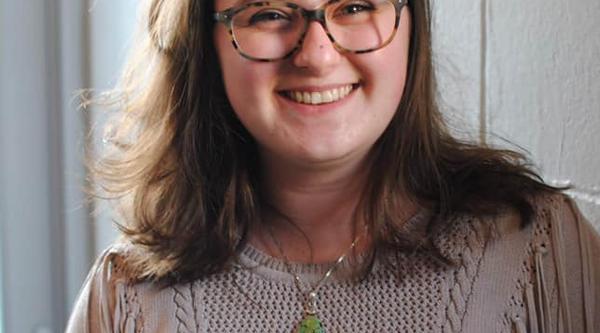 Melissa Ayling head and shoulders leaning against a wall