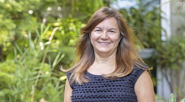 Monique McKay surrounded by greenery