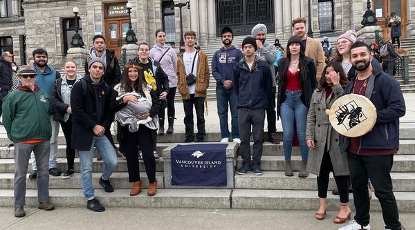 group shot of VIU students and staff standing in front of the Legislature