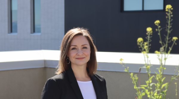 Dr. Patricia Johnston standing outside at VIU looking at camera
