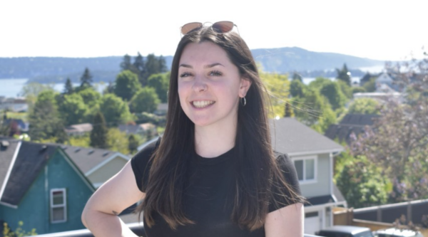 Jane Dean looking at the camera on a sunny day and smiling