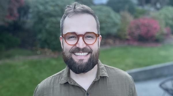 Neil Surkan smiling at the camera