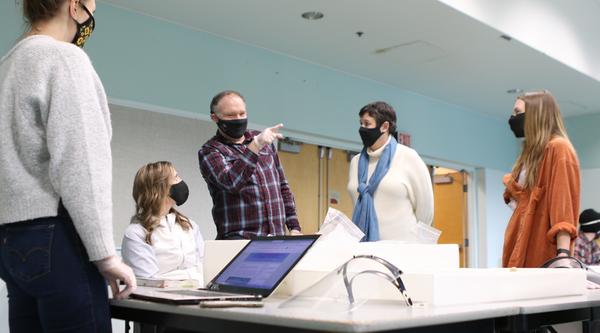 VIU students and instructor wearing masks and talking