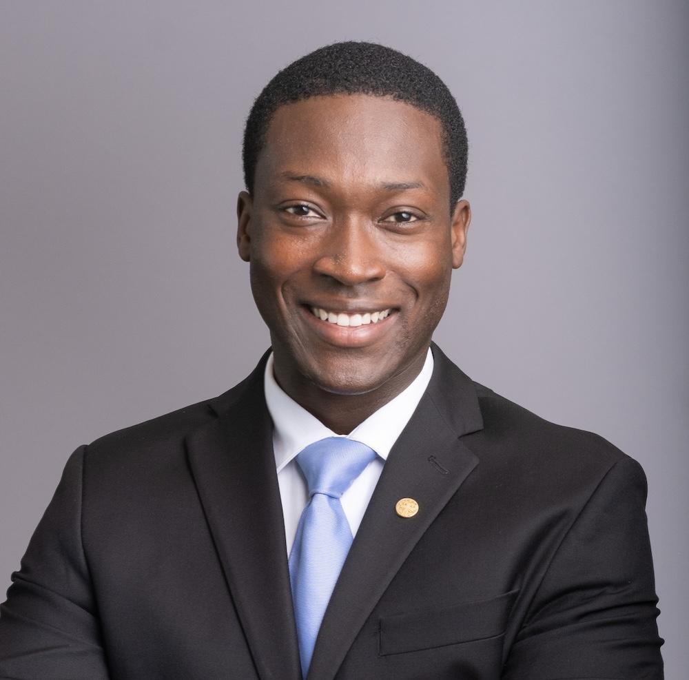 George Anderson wearing a suit with a blue tie