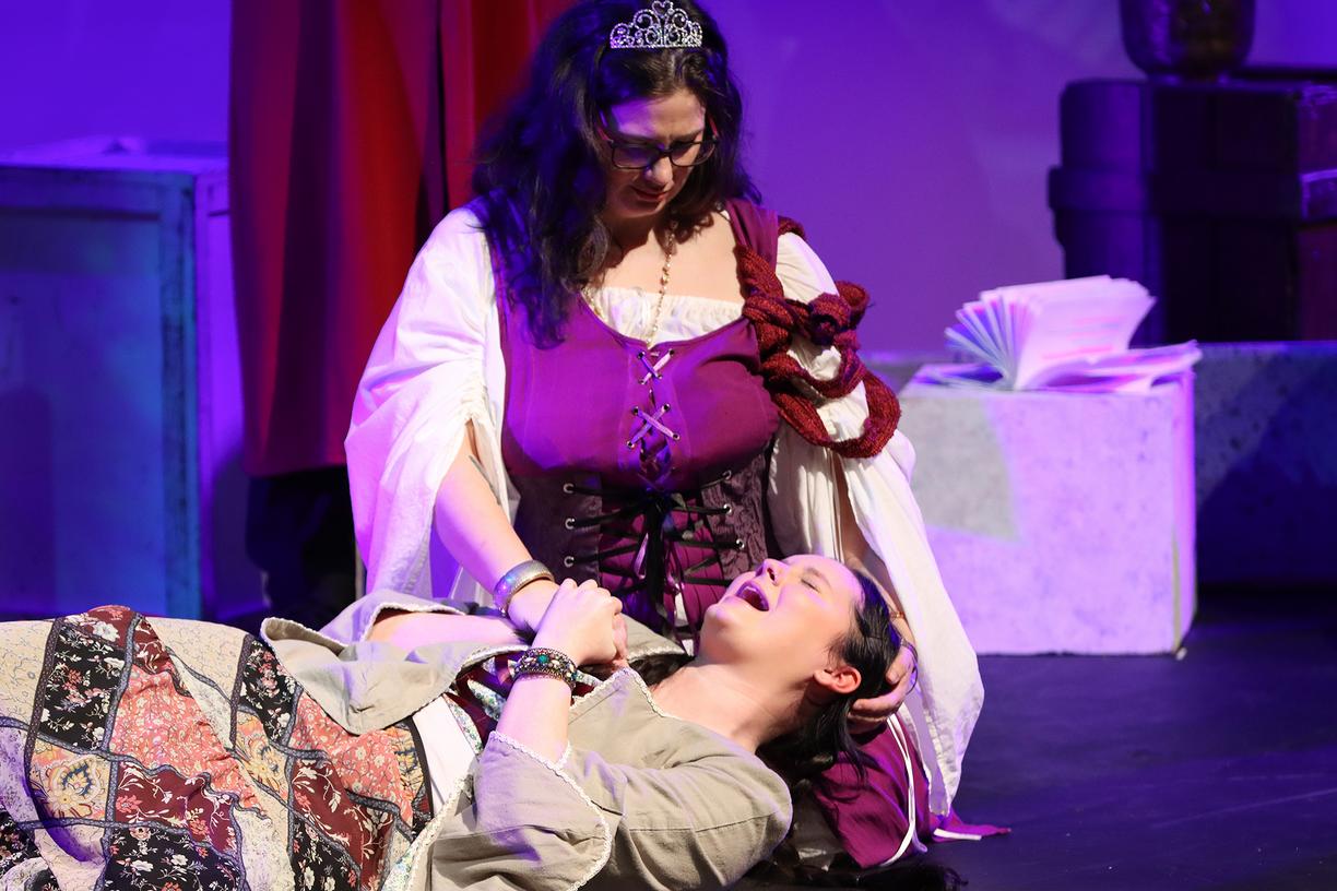 A student lies in another students arms