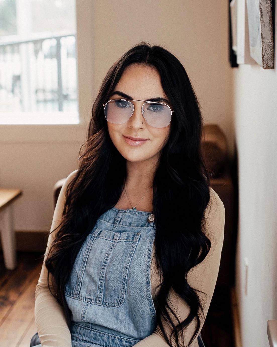 Samantha Beyond sitting and looking directly at camera