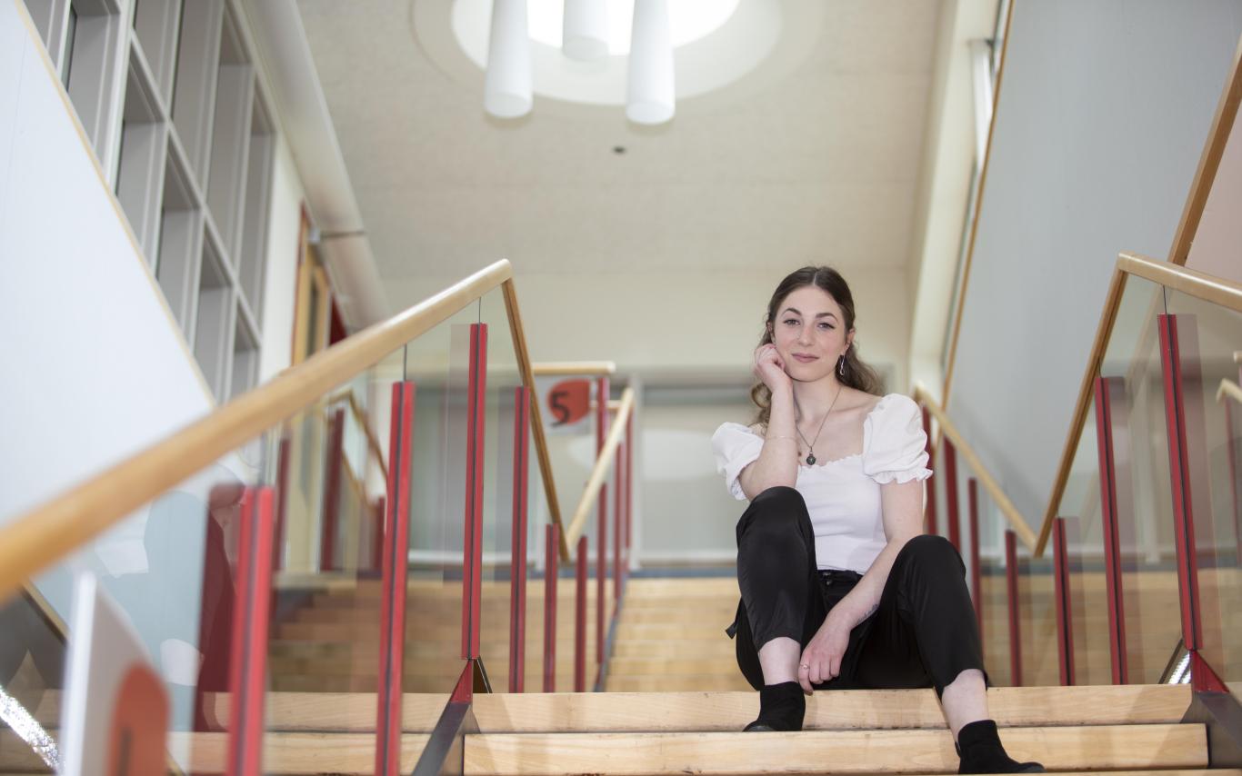 woman sitting on a set of stairs