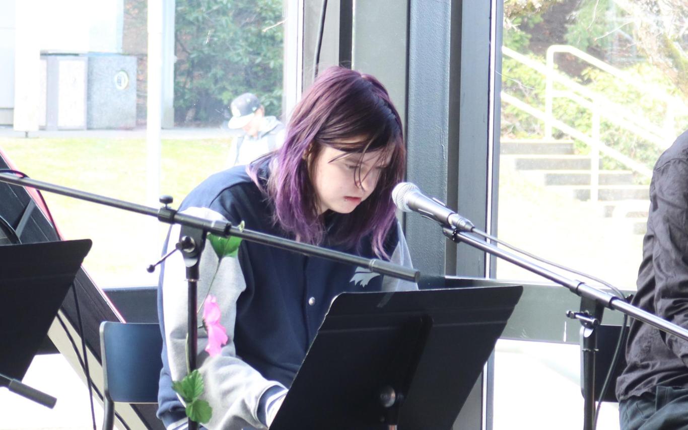 Ceridwen Nord does a dramatic reading during VIU's International Women's Day event.