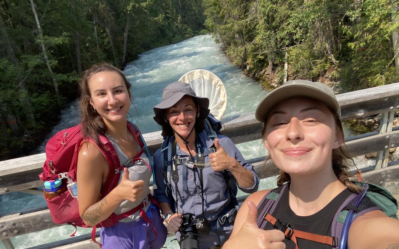 Lizzy Schafers, Jasmine Janes and Emma Peterson  give the thumbs up sign while taking a selfie.
