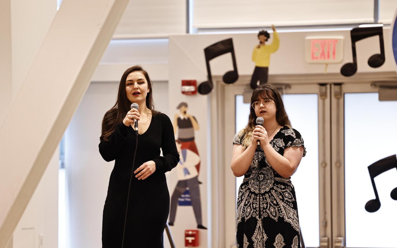 Sarah Hart and Sevilya Hendricks performing a song together at the Chinese Bridge Singing contest at UBC
