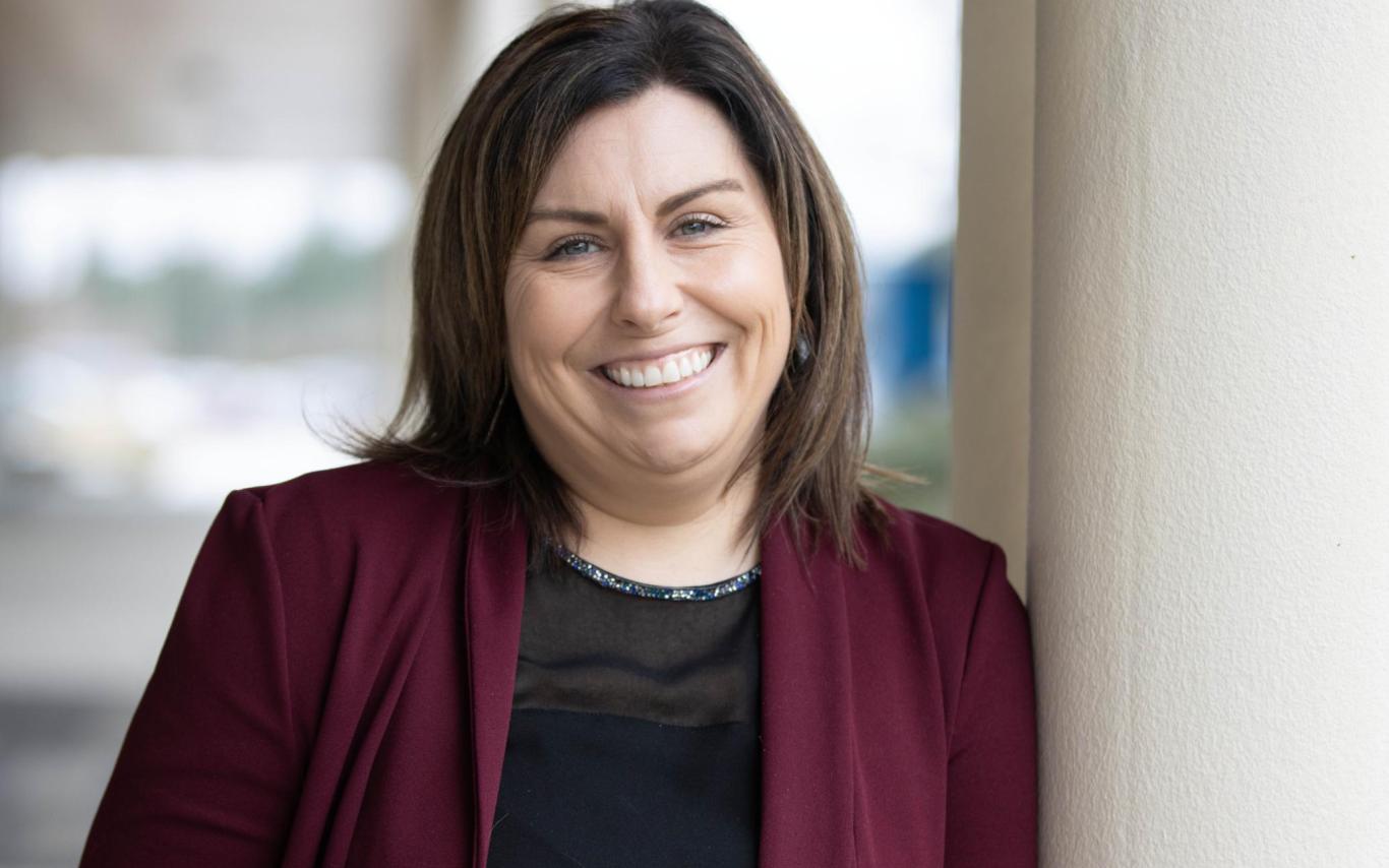 Liette Masse leans against a pole on VIU's Nanaimo campus