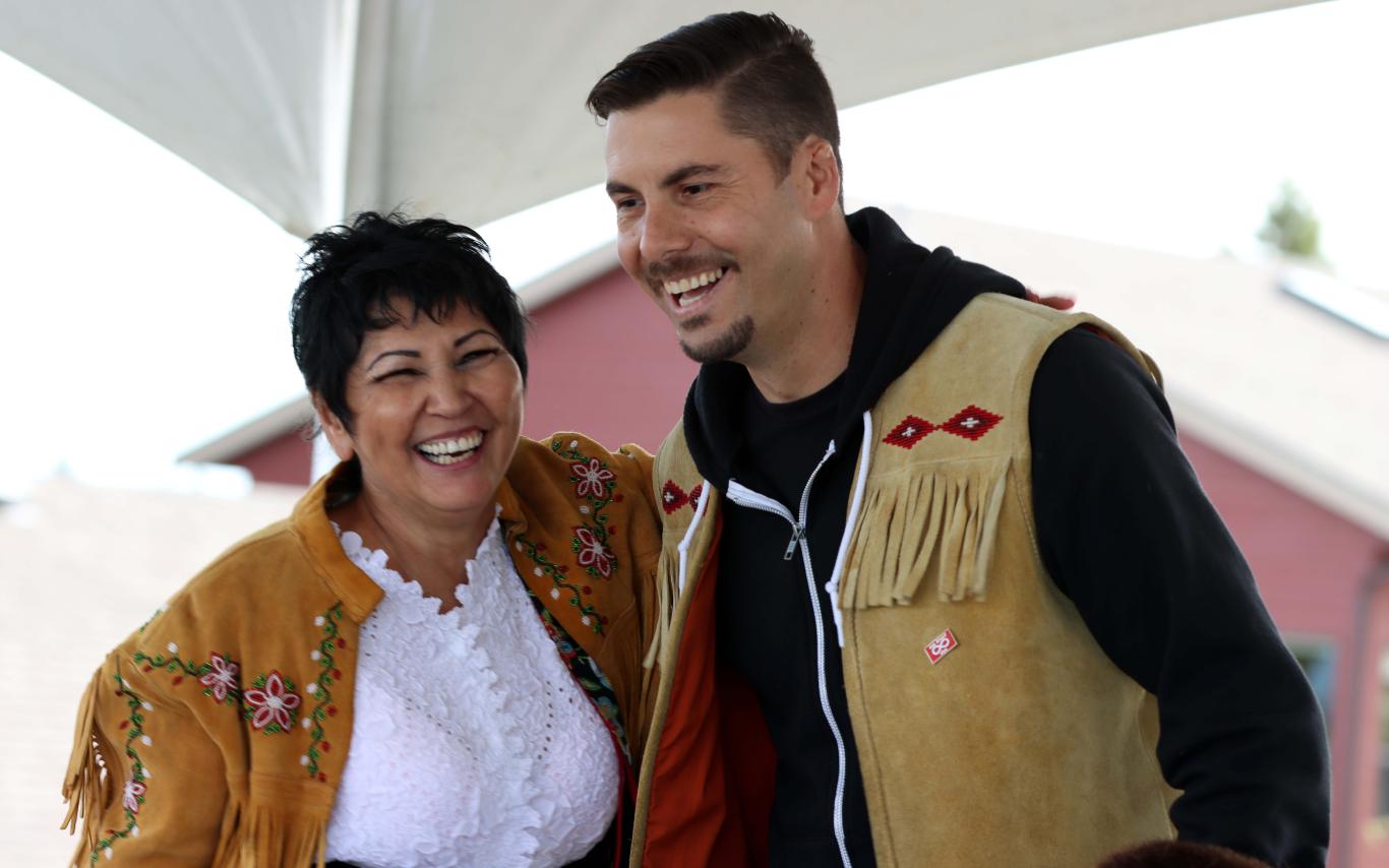 Woman and a man dance on a stage