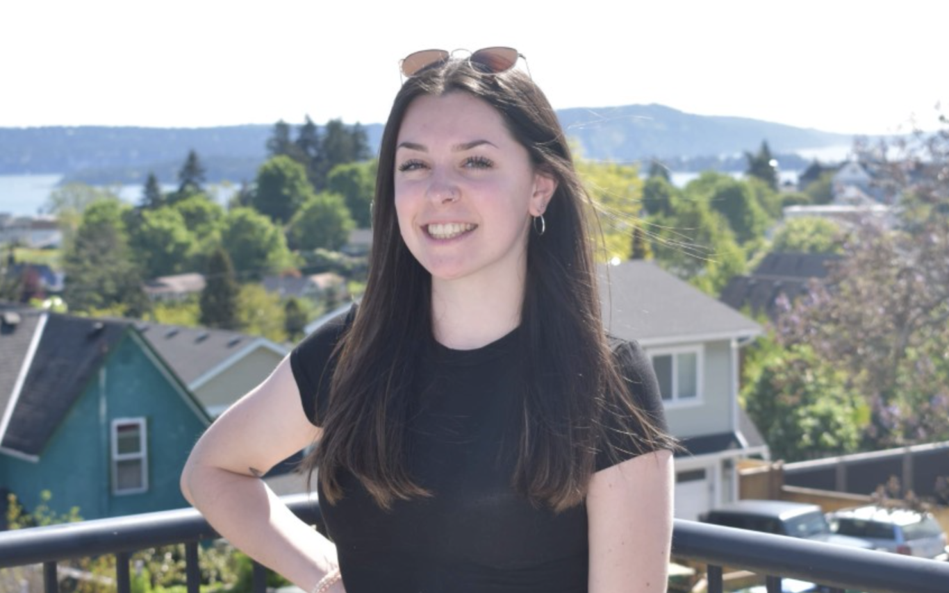 Jane Dean looking at the camera on a sunny day and smiling