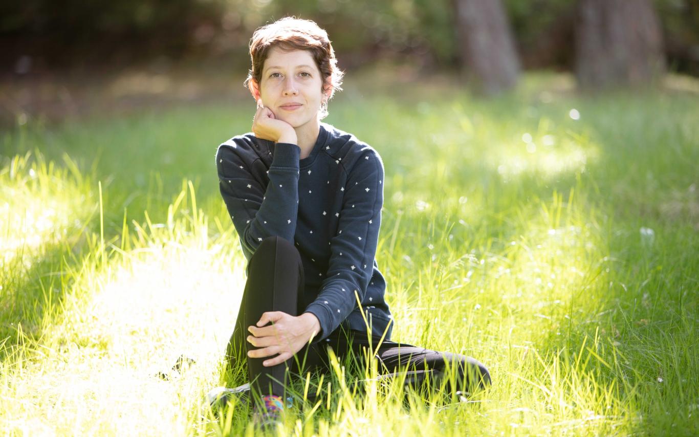 Student sitting in grass