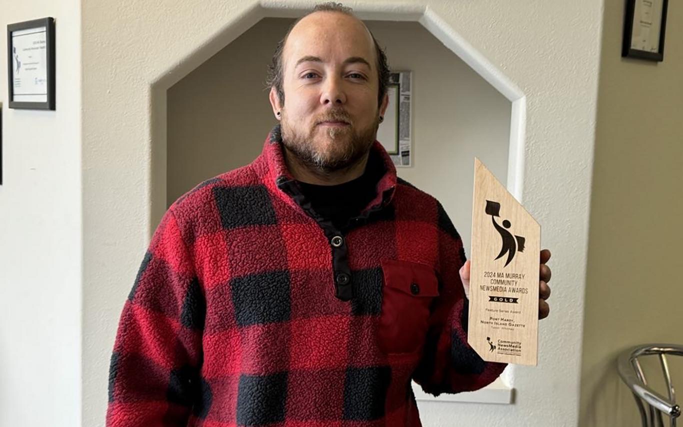 Tyson holds up his Ma Murray award